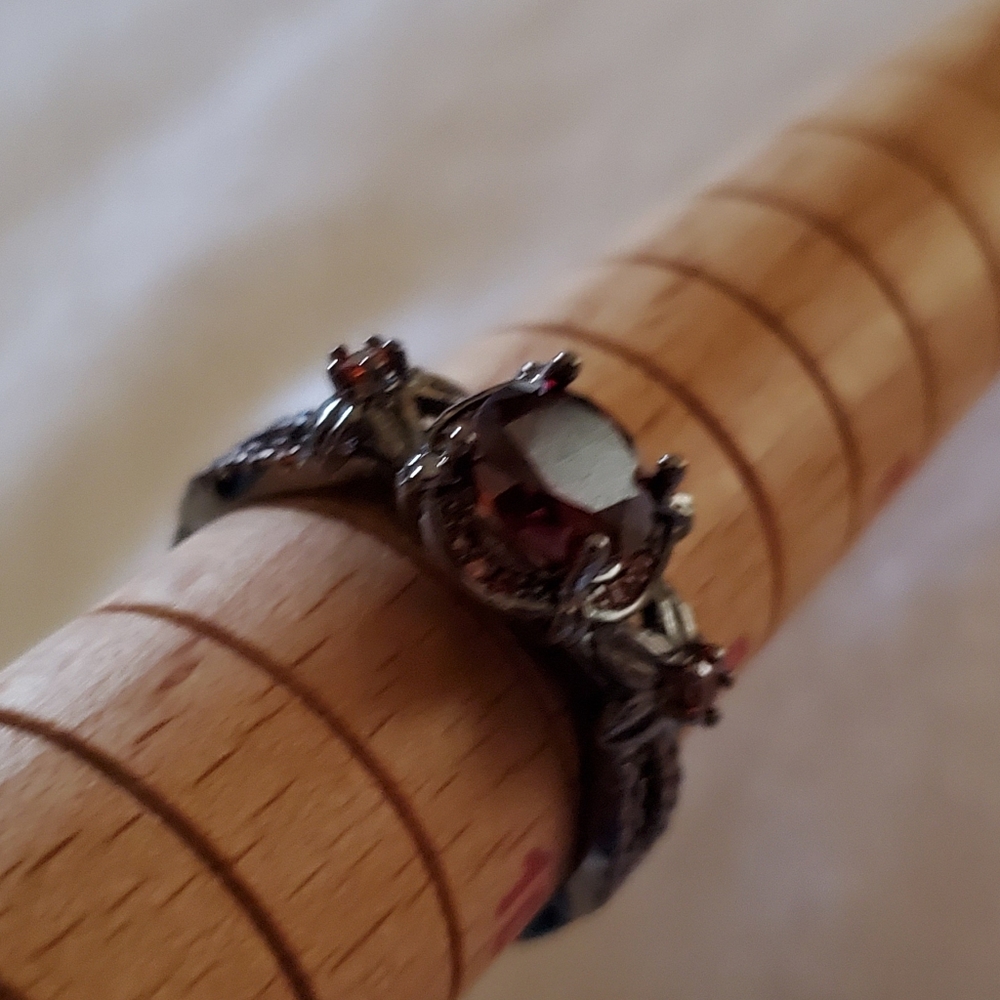 Garnet colored ring on black band - Picture 5 of 5